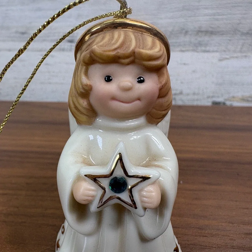Lenox May birthstone Porcelain Angel Ornament features a hand-painted gold halo